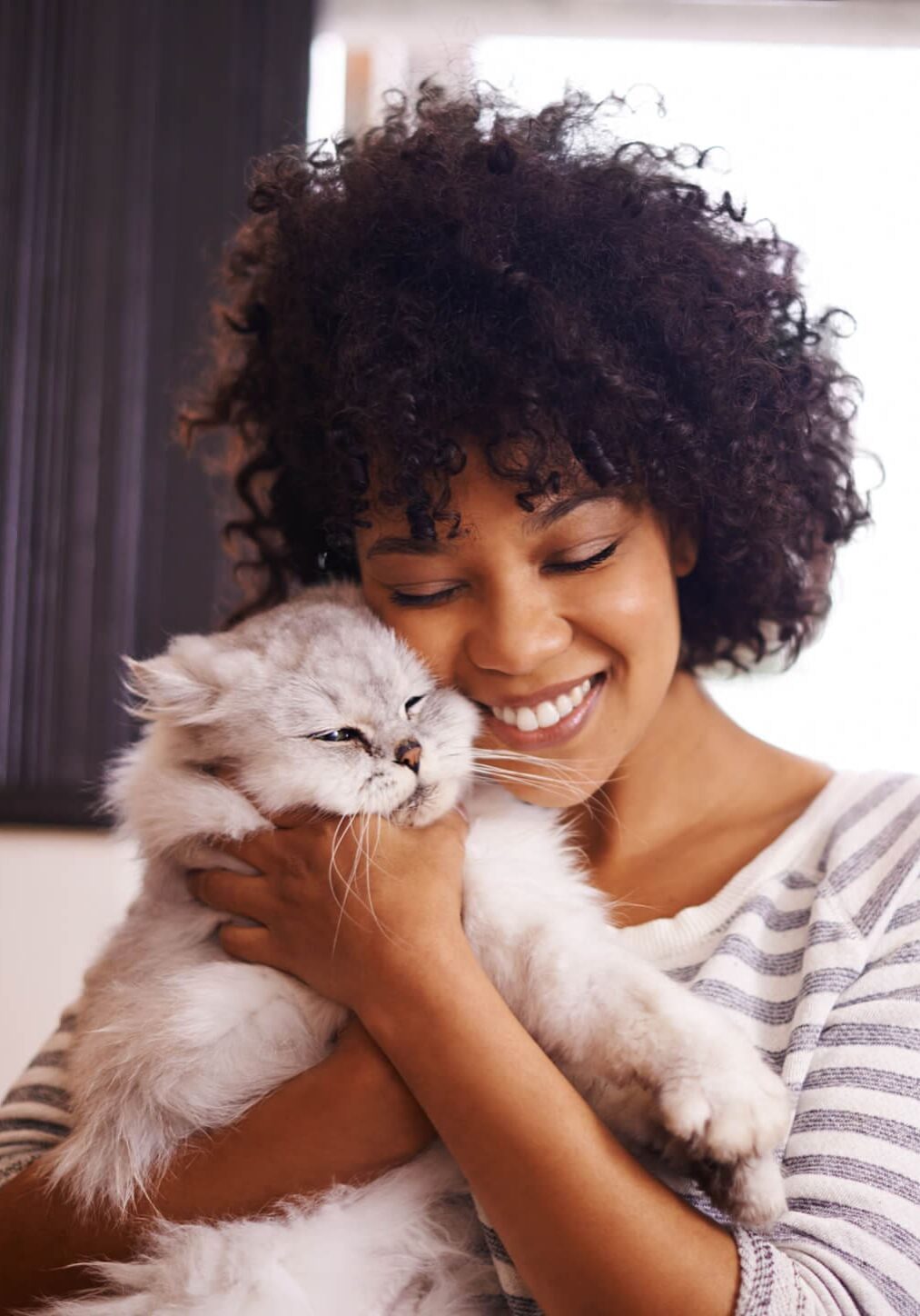 Woman Snuggling White Cat